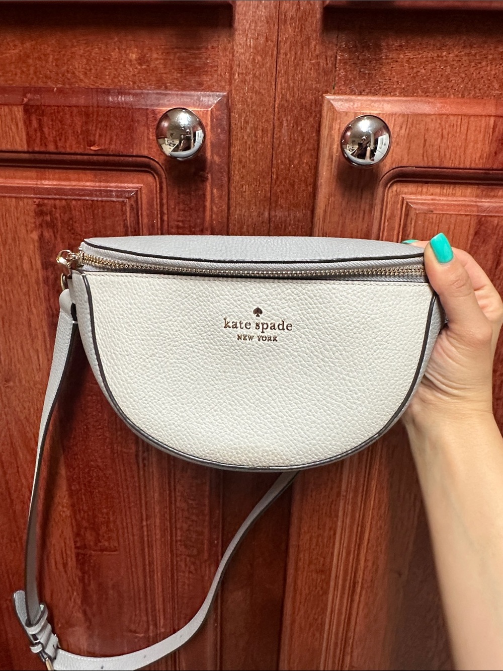 kate spade Ivory Pebbled Leather Crescent Crossbody with Gold Tone Hardware